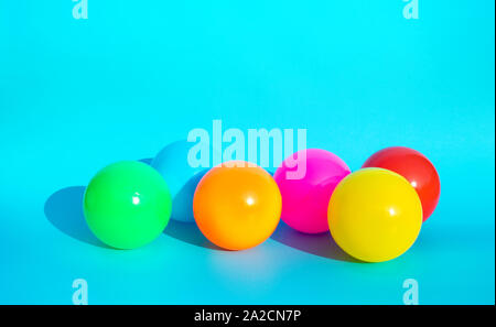 Colorful balloon with shadow on blue color background.party and celebration concepts ideas Stock Photo