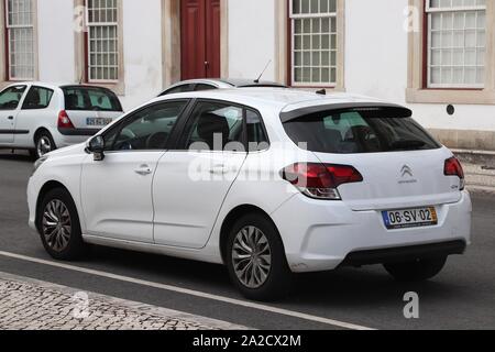 COIMBRA, PORTUGAL - MAY 26, 2018: Citroen C4 compact white hatchback car in Portugal. There are more than 5.1 million motor vehicles registered in Por Stock Photo