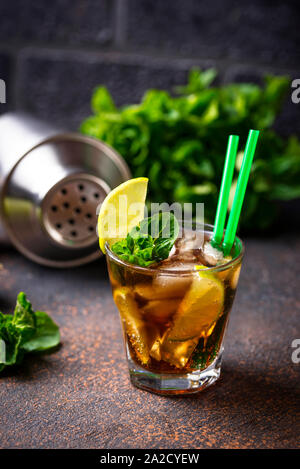 Cuba libre cocktail with mint and lime Stock Photo