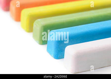 Close up of colorful chalk sticks on white background Stock Photo