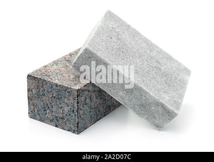 Unpolished granite and marble stone blocks isolated on white Stock Photo