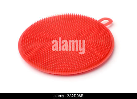 Silicone red dish washing brush scrubber isolated on whie Stock Photo