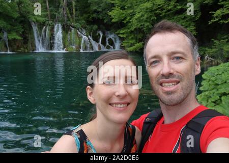 Croatia couple selfie. Plitvice Lakes National Park. Stock Photo