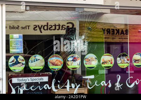 Broken shop window due to vandalism Stock Photo