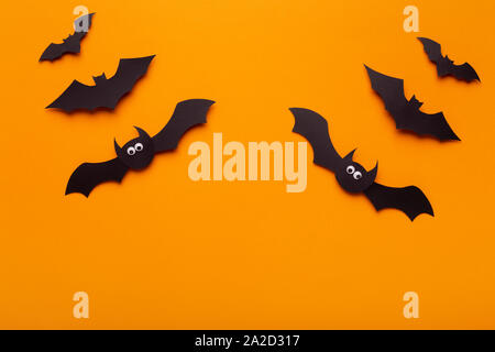 Creative composition of Halloween bats on orange background Stock Photo
