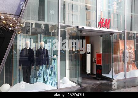 TOKYO, JAPAN - DECEMBER 1, 2016: H&M casual fashion store in Ginza district of Tokyo, Japan. Ginza is a legendary shopping area in Chuo Ward of Tokyo. Stock Photo