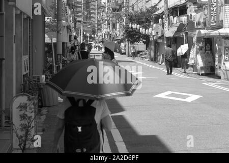 Osaka - 大阪市 - Street scene - People with sunshade Stock Photo