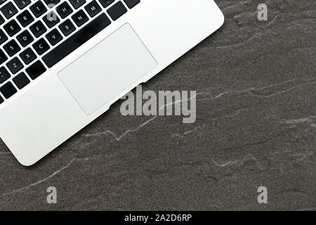 Laptop computer on a stone table with a modern look Stock Photo