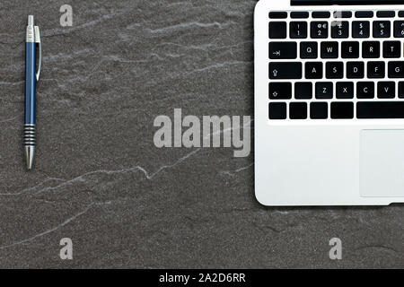 Laptop computer on a stone table with a modern look Stock Photo