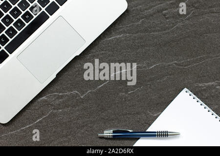 Laptop computer on a stone table with a modern look Stock Photo