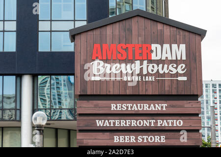 Amsterdam BrewHouse - on the lake sign on the road in-front of the popular waterfront brewery and restaurant. Stock Photo