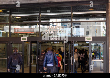 Commuters enter Union Station at entrance to GO Train platforms. Stock Photo
