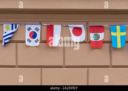 World country flags hanging on the street Stock Photo