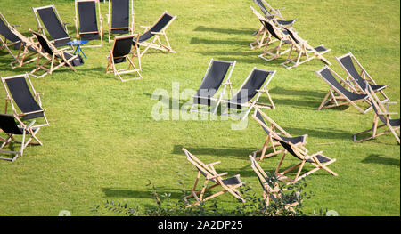 Sun loungers are placed on the lawn waiting for idle people Stock Photo