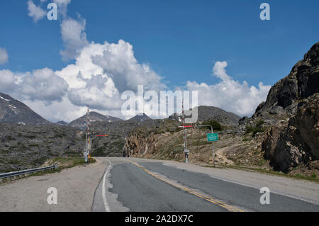Border between Canada and Alaska at White Pass in summer with puffy clouds. Stock Photo