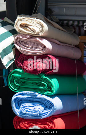 Fabrics in different patterns lined up in a row. Stock Photo