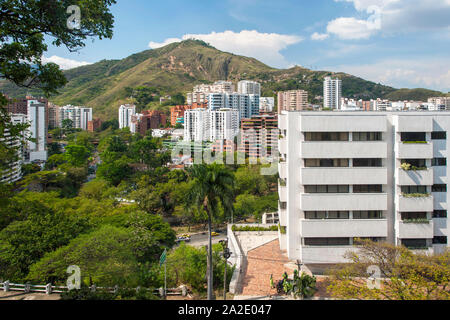 View of the Cali River and buildings on the slopes of El Cerro De Las Tres Cruces (Hill of the Three Crosses) in the city of Cali, Colombia. Stock Photo