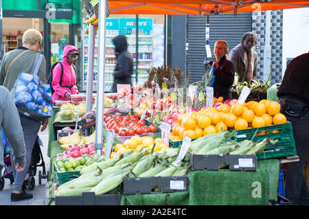 People viewing produce on display at Croydon historic surrey street market Stock Photo