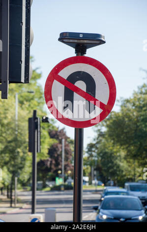 No U turn sign board at a signal junction Stock Photo