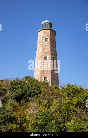 Old Cape Henry Lighthouse in Fort Storm, Virginia Beach, Virginia against blue skies. Stock Photo