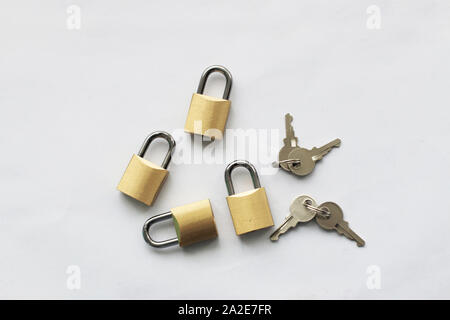 Keys and padlocks isolated against white background Stock Photo