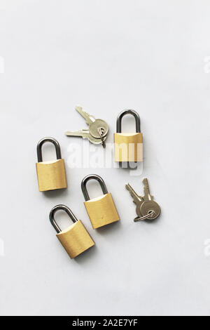 Keys and padlocks isolated against white background Stock Photo