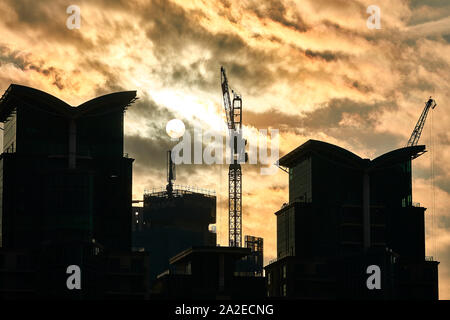 London, U.K. - Jan 21, 2019: The sun glows through dense cloud over the St George Wharf development in the Vauxhall area of London. Stock Photo
