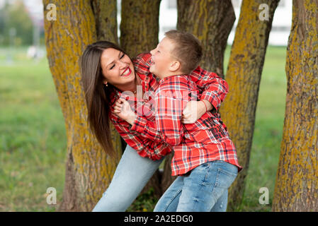 Mom and son indulge, laughing merrily Stock Photo - Alamy