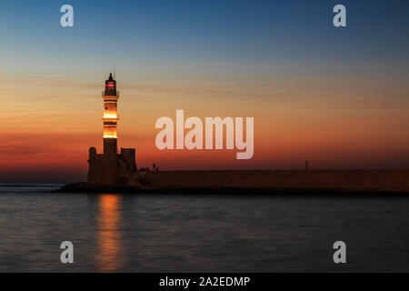 Chania Old harbor Lighthouse at sunset Stock Photo