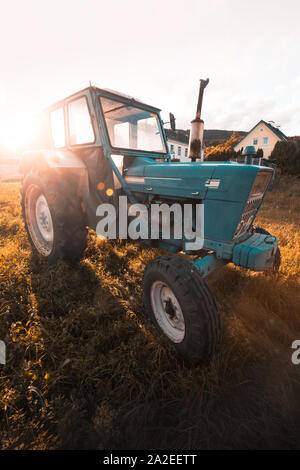 old tractor on the grass field Stock Photo - Alamy