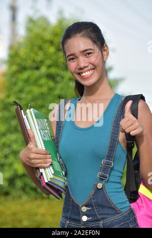 Filipino Student With Thumbs Up With Books Stock Photo - Alamy