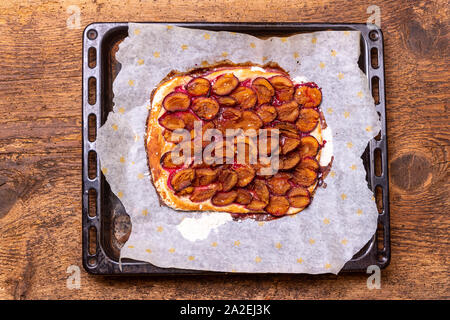 bavarian plum pie on dark wood Stock Photo
