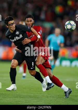 Liverpool. 2nd Oct, 2019. Liverpool's Joe Gomez (R) vies with Salzburg's Hwang Hee-Chan during the UEFA Champions League Group E match between Liverpool and Salzburg in Liverpool, Britain on Oct. 2, 2019. Liverpool won 4-3. Credit: Han Yan/Xinhua/Alamy Live News Stock Photo