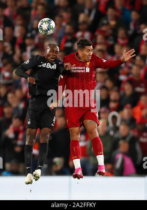 Liverpool. 2nd Oct, 2019. Liverpool's Roberto Firmino (R) vies with Salzburg's Enock Mwepu during the UEFA Champions League Group E match between Liverpool and Salzburg in Liverpool, Britain on Oct. 2, 2019. Liverpool won 4-3. Credit: Han Yan/Xinhua/Alamy Live News Stock Photo