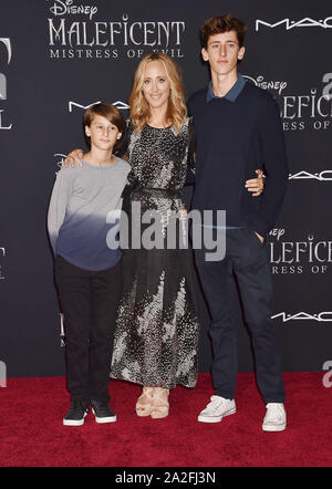 HOLLYWOOD, CA - SEPTEMBER 30: (L-R) Leo Kipling Boyer, Kim Raver, Luke West Boyer attend the World Premiere of Disney's “Maleficent: Mistress of Evil' at El Capitan Theatre on September 30, 2019 in Los Angeles, California. Stock Photo