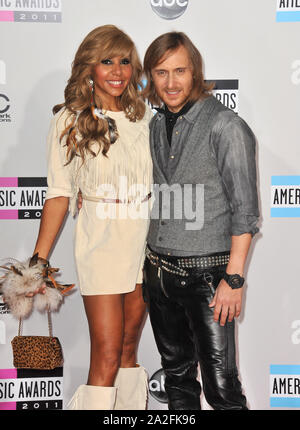 LOS ANGELES, CA. November 20, 2011: David Guetta & Cathy Guetta at the 2011 American Music Awards at the Nokia Theatre L.A. Live in downtown Los Angeles. © 2011 Paul Smith / Featureflash Stock Photo