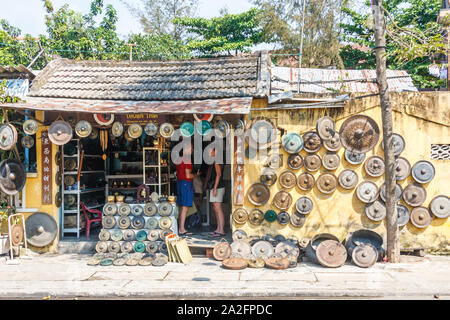 Hoi An, Vietnam - March 3rd 2010: Shop selling pans. There are many small shops in the town, Stock Photo