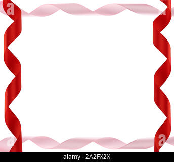 curled red and pink satin ribbons isolated on white background, festive backdrop, copy space Stock Photo