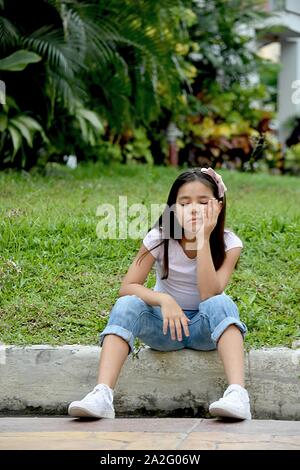 A Young Minority Juvenile And Sadness Stock Photo