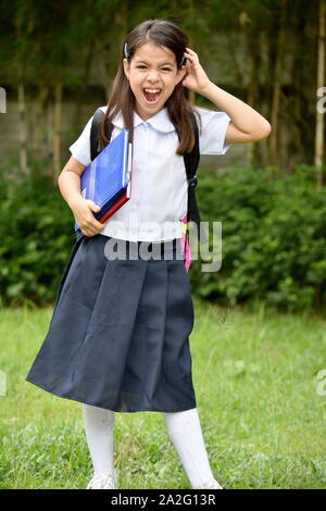 Young Filipina School Girl And Anxiety Wearing School Uniform Stock Photo