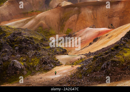 Hiker in surreal, colorful landscape at Landmannalaugar, Iceland Stock Photo