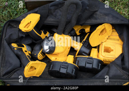 tool set in a bag is battery powered and includes a light, drill, and other small hand tools, with extra batteries Stock Photo