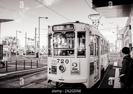 DEC 2, 2018 Hakodate, JAPAN - Hakodate city tram vintage streetcar at station near JR train station. The Tram well-established network throughout the Stock Photo