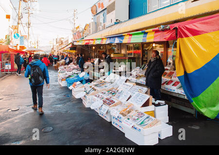 DEC 2, 2018 Hakodate, Japan - Japanese seafood shops with sellers and buyers at Hakodate Asaichi fish market Hokkaido. Famous fresh seafood and street Stock Photo