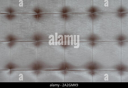 Light black luxury upholstery sofa texture background concept for clean gray vintage leather furniture pattern wallpaper, closeup interior elegant arm Stock Photo