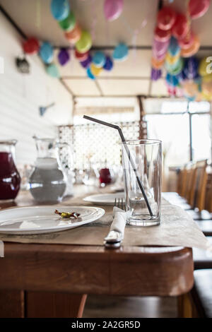 Preparation of banquet tables and cafe premises for children's party. Stock Photo