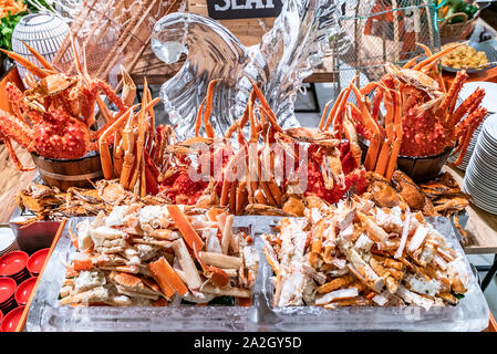 Alaskan King crab in seafood on ice buffet bar Stock Photo