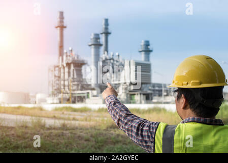Engineers working in power stations. Stock Photo