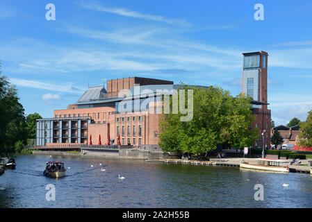 River Boat Cruising Along River Avon & the Royal Shakespeare Theatre Stratford-upon-Avon England UK Stock Photo