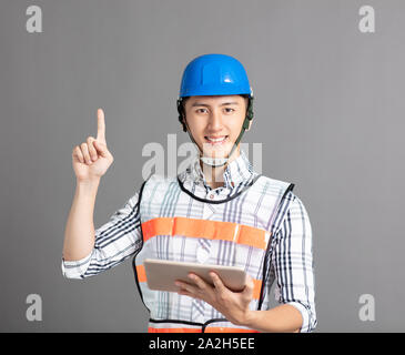 smiling asian young man construction worker Stock Photo